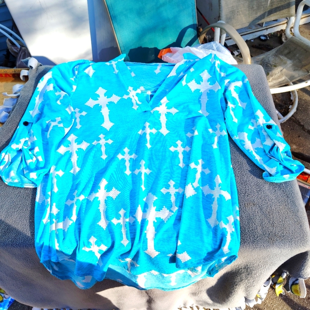 Green blouse with white crosses size L not sure brand but I think stitch fix